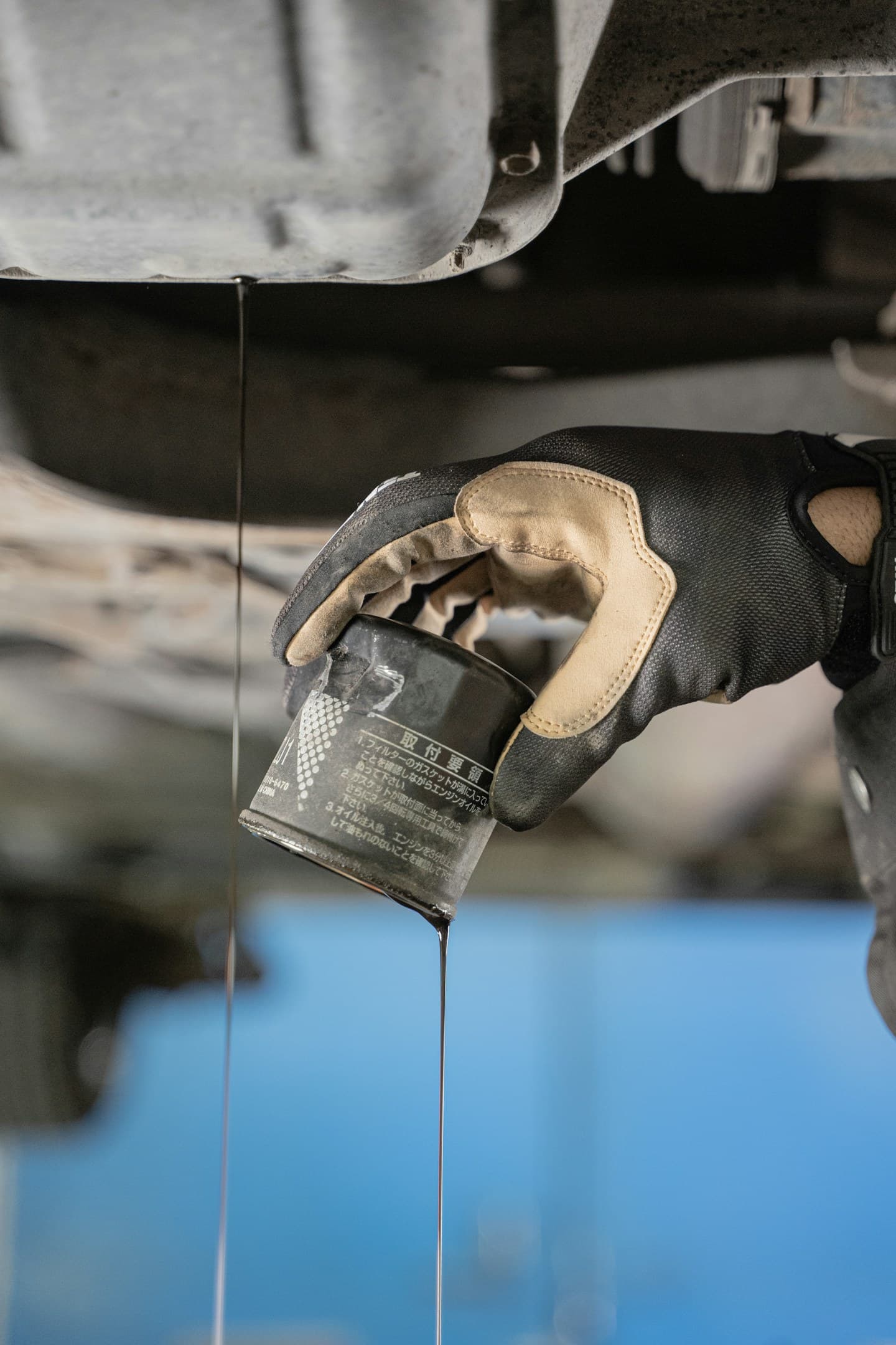 Technician replacing an engine oil filter